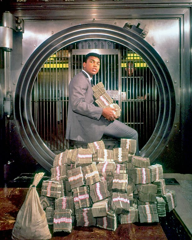 Muhammad Ali with his winnings in 1974